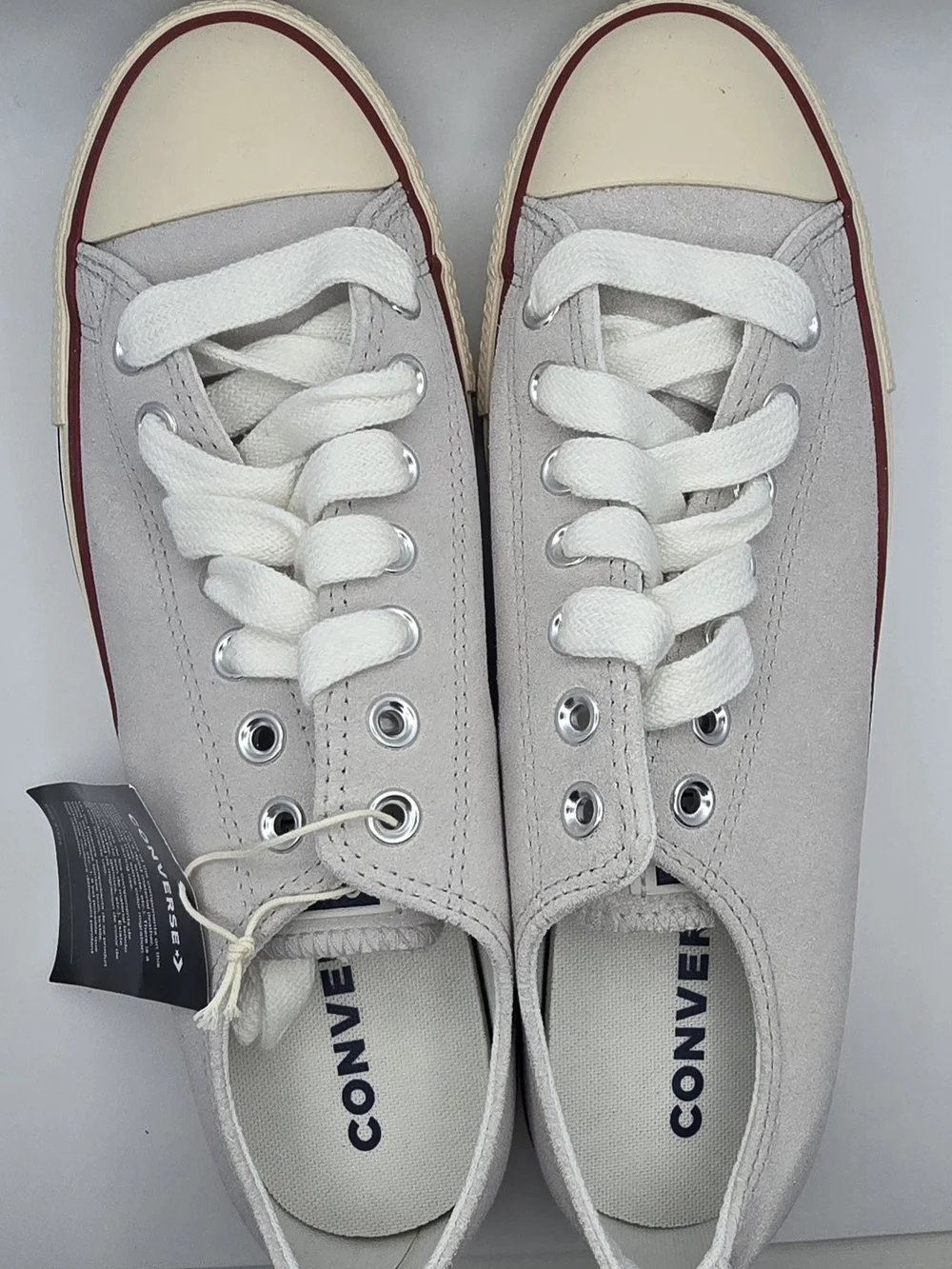 Converse Low-Top Sneakers in Light Gray with Cream Soles and Red/Navy Stripe